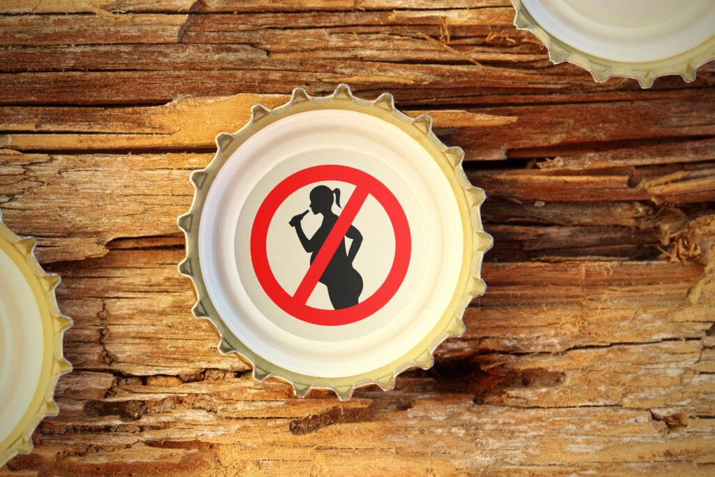 Tappo di bottiglia con impresso simbolo di divieto di bere alcolici in gravidanza